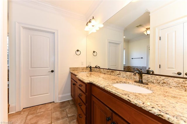 bathroom with crown molding and vanity