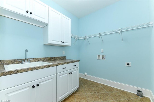 laundry room with sink, hookup for a washing machine, hookup for a gas dryer, hookup for an electric dryer, and cabinets