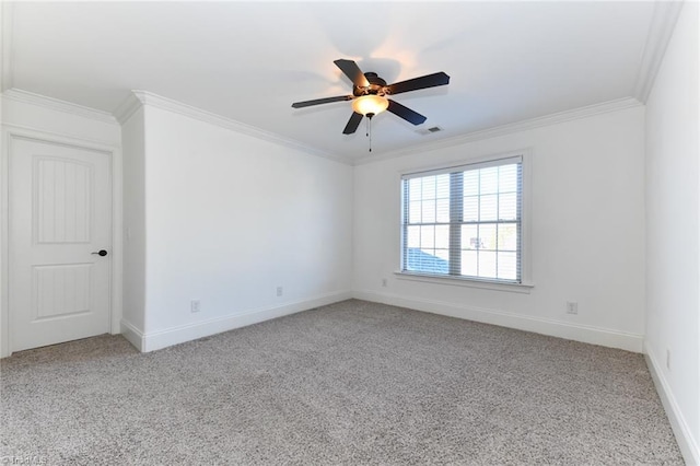 carpeted empty room featuring ceiling fan and crown molding