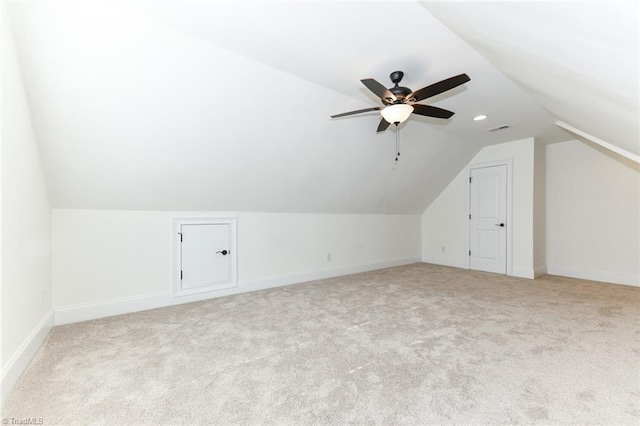 bonus room featuring ceiling fan, light carpet, and lofted ceiling