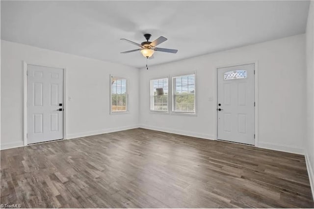 foyer entrance featuring baseboards, a ceiling fan, and wood finished floors