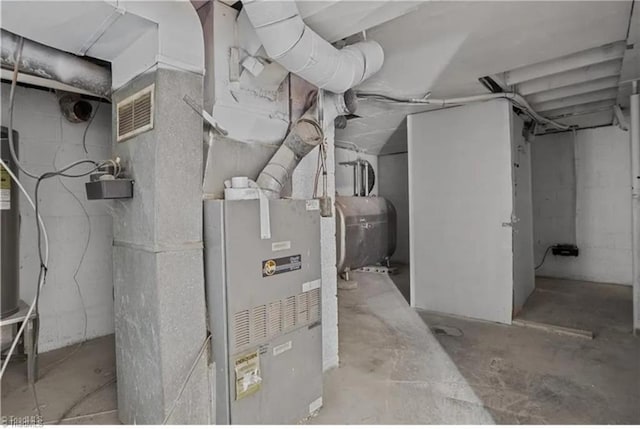 utility room featuring visible vents and heating fuel