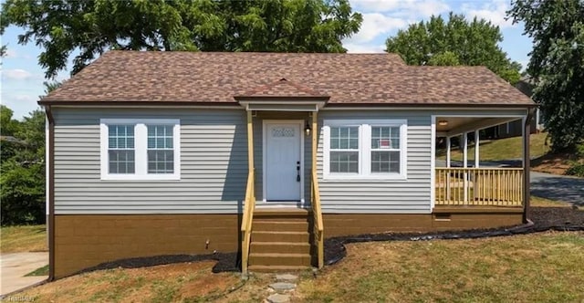 view of front of home with roof with shingles