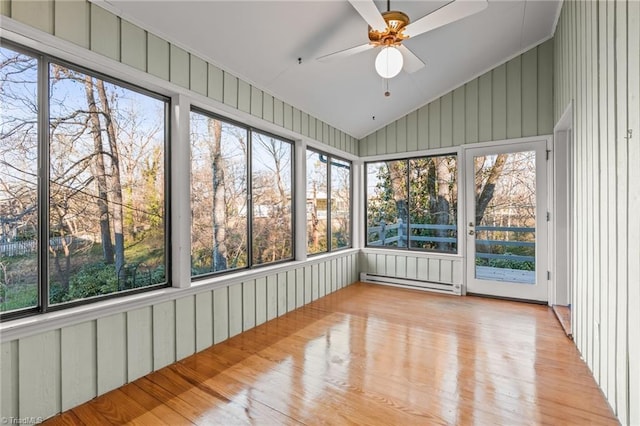 unfurnished sunroom featuring ceiling fan, lofted ceiling, and a baseboard heating unit