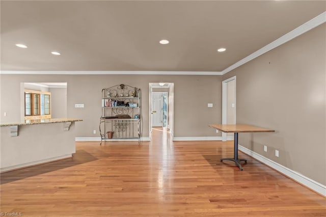 interior space featuring light hardwood / wood-style flooring and ornamental molding