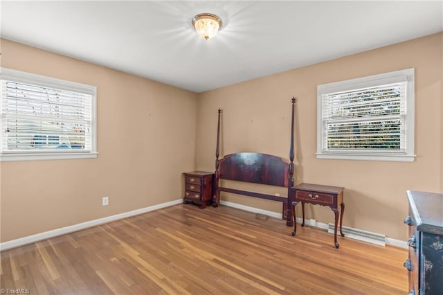 bedroom featuring wood-type flooring