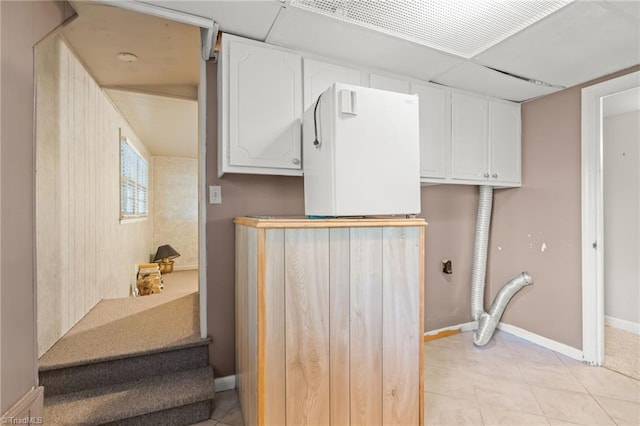 interior space with cabinets and hookup for an electric dryer