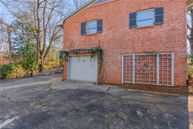 view of side of property with a garage