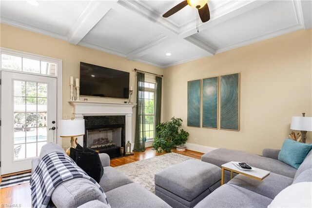 3303 Tanner Ct, Summerfield, NC 27358 - living area featuring ceiling fan, beamed ceiling, wood finished floors, and a healthy amount of sunlight