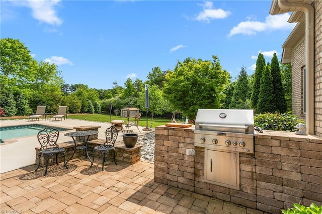 3303 Tanner Ct, Summerfield, NC 27358 - view of patio featuring area for grilling, an outdoor pool, and exterior kitchen