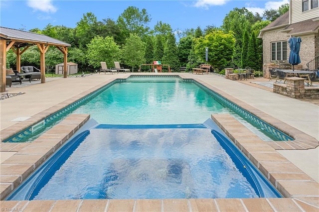 3303 Tanner Ct, Summerfield, NC 27358 - pool featuring a gazebo, a patio area, a storage shed, and an outdoor structure