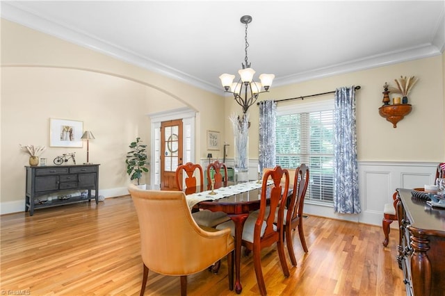 3303 Tanner Ct, Summerfield, NC 27358 - dining area with ornamental molding, a healthy amount of sunlight, a chandelier, and arched walkways