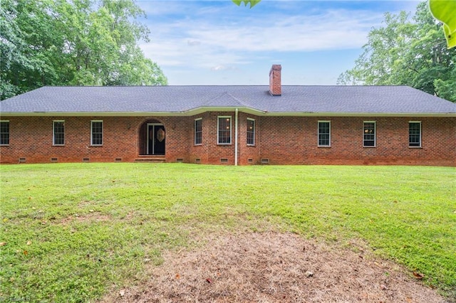 ranch-style home with a front yard