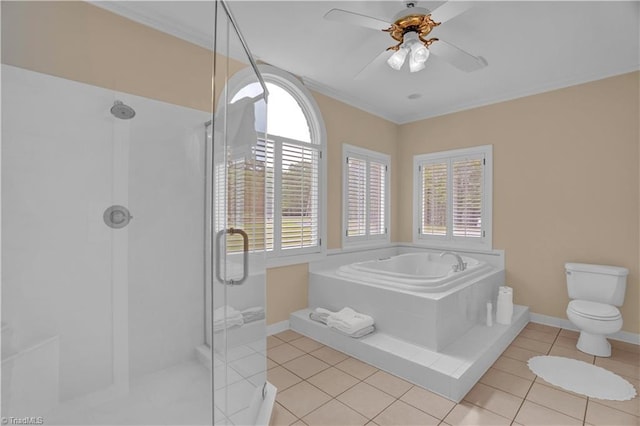 bathroom with ceiling fan, plenty of natural light, and tile patterned floors