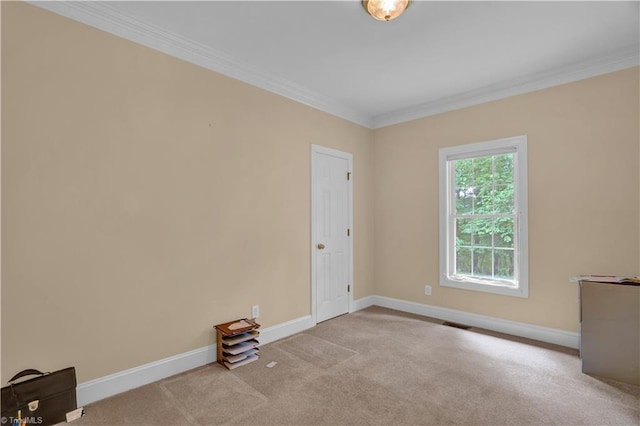 carpeted spare room with ornamental molding