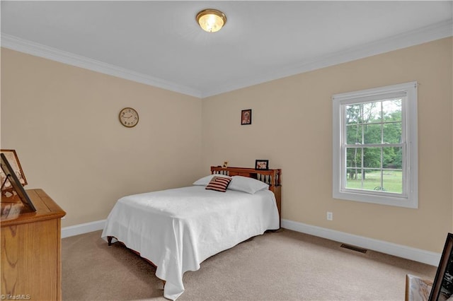 carpeted bedroom with crown molding