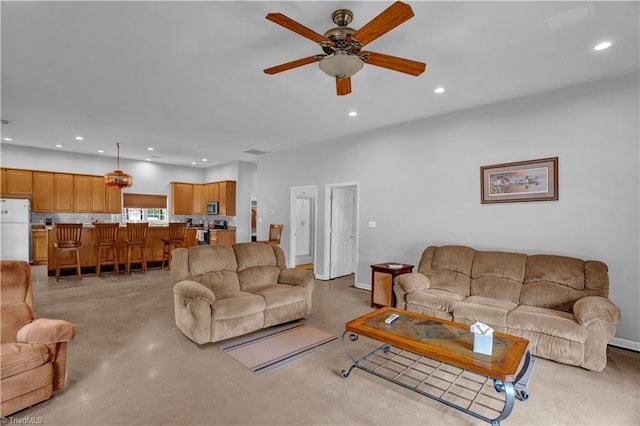 living room featuring ceiling fan