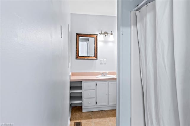 full bathroom with vanity, curtained shower, and visible vents