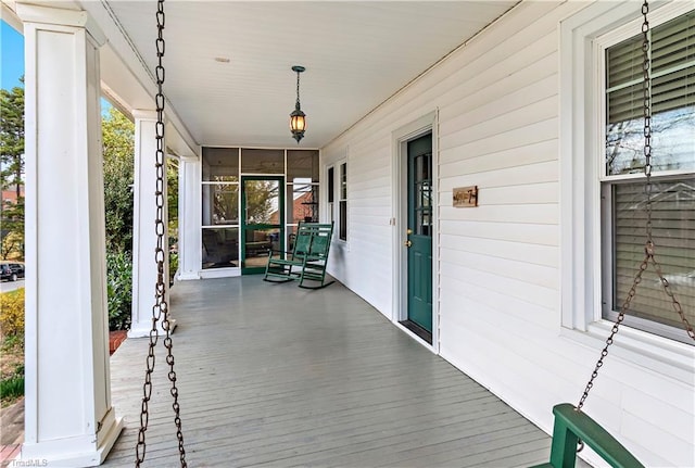 wooden deck featuring a porch