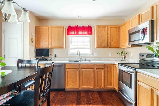 6919 Channel Forest Rd, Belews Creek, NC 27009 - kitchen with stainless steel appliances, light countertops, and dark wood-style flooring
