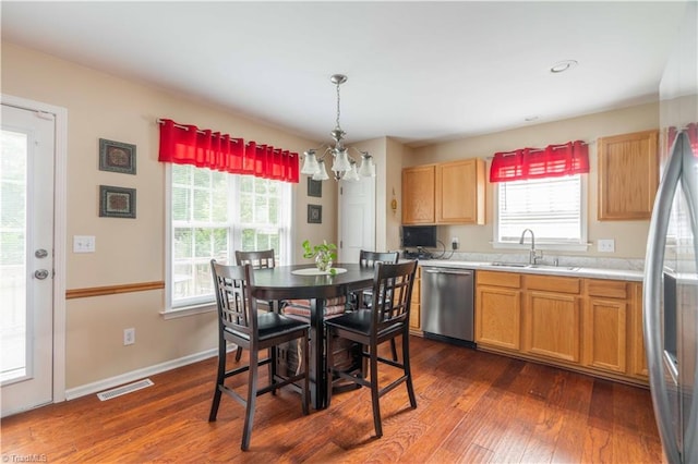 6919 Channel Forest Rd, Belews Creek, NC 27009 - dining area with a chandelier and dark wood finished floors