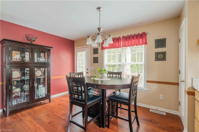 6919 Channel Forest Rd, Belews Creek, NC 27009 - dining room featuring a chandelier and wood finished floors