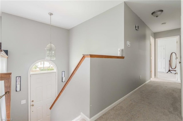 6919 Channel Forest Rd, Belews Creek, NC 27009 - carpeted foyer with baseboards and a chandelier