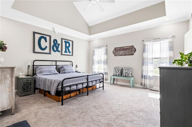 bedroom with a ceiling fan, carpet floors, lofted ceiling, and baseboards