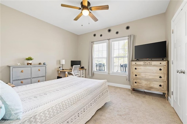bedroom featuring a ceiling fan, baseboards, and carpet