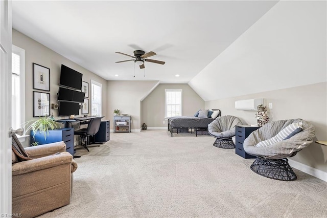 office area featuring baseboards, lofted ceiling, light colored carpet, and ceiling fan