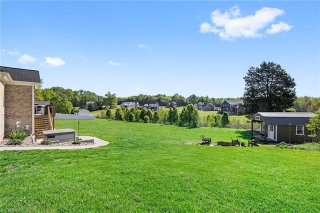 view of yard with an outbuilding and stairway