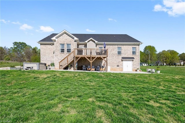 back of property with brick siding, a lawn, stairway, and a deck