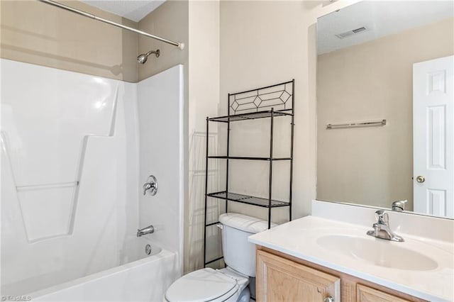 full bathroom with bathing tub / shower combination, vanity, and toilet