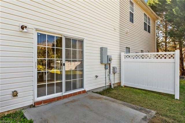 view of side of property featuring a patio area