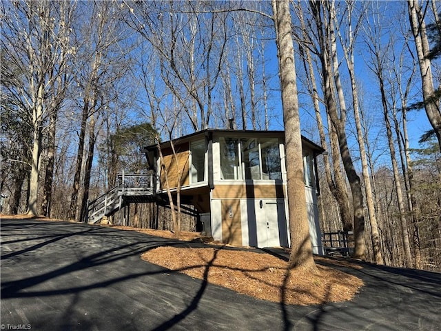 view of front of property featuring a deck and a sunroom