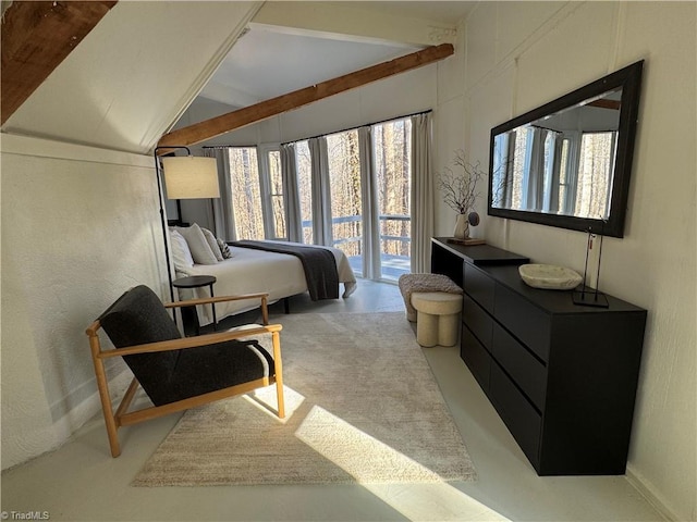 bedroom with access to outside and lofted ceiling with beams