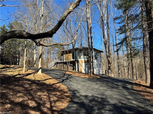 view of outbuilding featuring a sunroom