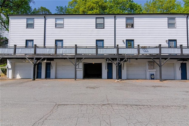 rear view of house with an attached garage