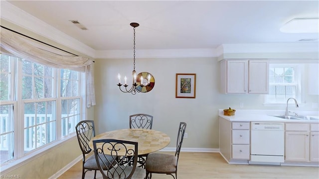 5423 Whitley Way, Greensboro, NC 27407 - dining space with light wood finished floors, healthy amount of natural light, and a chandelier