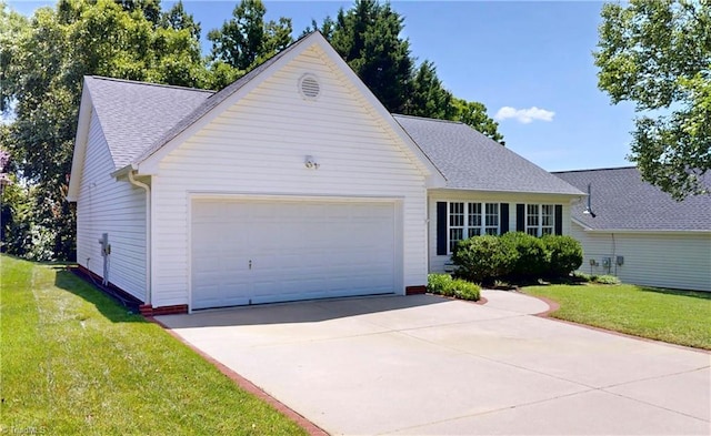 5423 Whitley Way, Greensboro, NC 27407 - view of front of house featuring a garage, a front yard, driveway, and a shingled roof