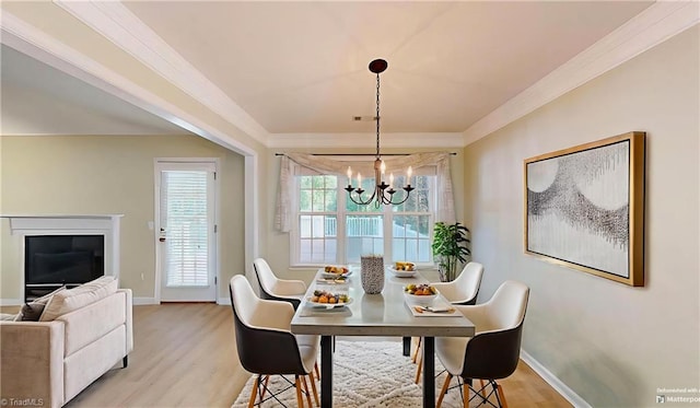 5423 Whitley Way, Greensboro, NC 27407 - dining room with crown molding, a chandelier, and light wood-style flooring