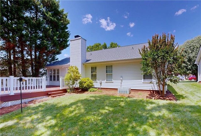 5423 Whitley Way, Greensboro, NC 27407 - back of property featuring a deck, a yard, and a chimney