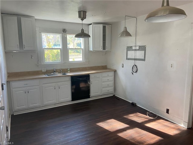 kitchen with dishwasher, decorative light fixtures, dark hardwood / wood-style floors, and sink