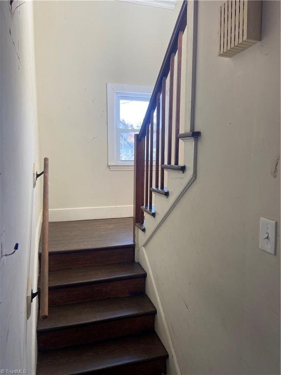 stairway featuring hardwood / wood-style flooring