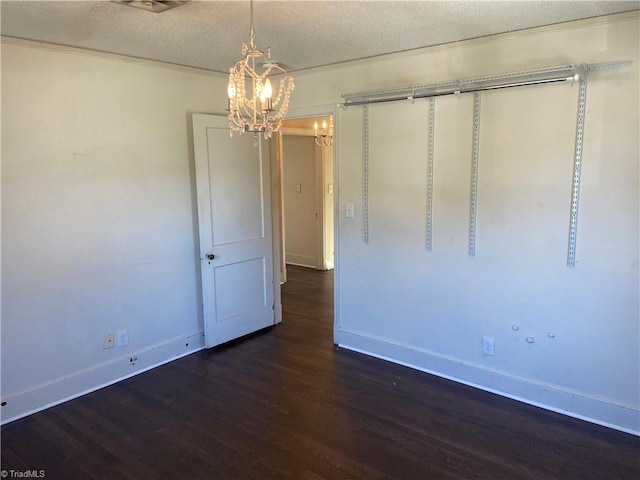 interior space with dark hardwood / wood-style floors and a textured ceiling