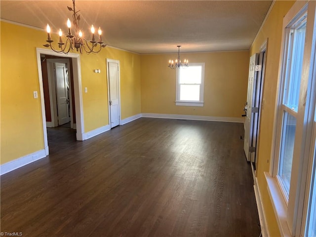 interior space with a chandelier and dark hardwood / wood-style floors