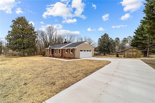 view of front of home with brick siding, driveway, and a garage