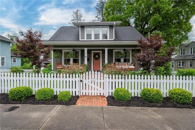 229 Orchard St, Mount Airy, NC 27030 - bungalow-style house with covered porch, a ceiling fan, a fenced front yard, and a gate