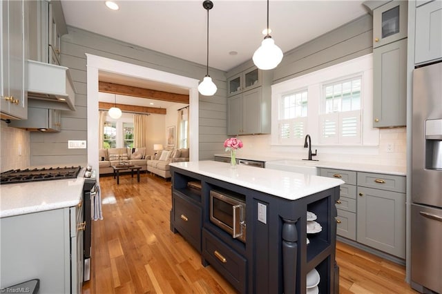 229 Orchard St, Mount Airy, NC 27030 - kitchen with stainless steel appliances, open shelves, backsplash, light countertops, and recessed lighting