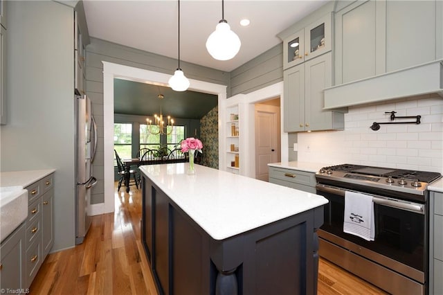 229 Orchard St, Mount Airy, NC 27030 - kitchen with appliances with stainless steel finishes, light countertops, tasteful backsplash, gray cabinetry, and recessed lighting